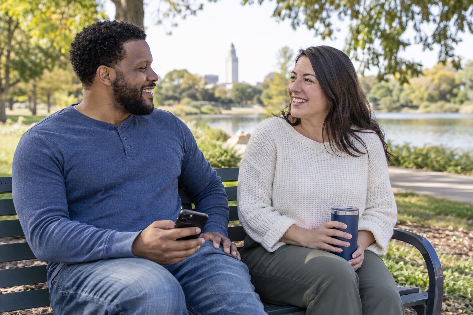 Two peers share an encouraging conversation with a phone close at hand